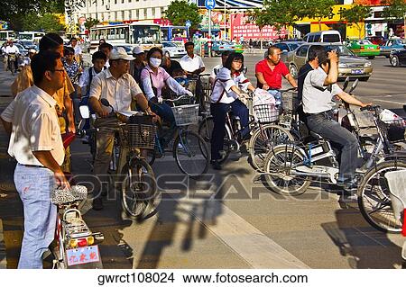 Group of people riding bicycles, HohHot, Inner Mongolia, China View Large Photo Image Picture - Group of people riding bicycles, HohHot, Inner Mongolia, China. Fotosearch