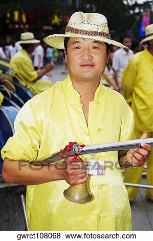 Portrait of a mid adult man holding a pedicab, Nanjing, Jiangsu Province, China View Large Photo Image Stock Photo - Portrait of a mid adult man holding a pedicab, Nanjing, Jiangsu Province, China. Fotosearch