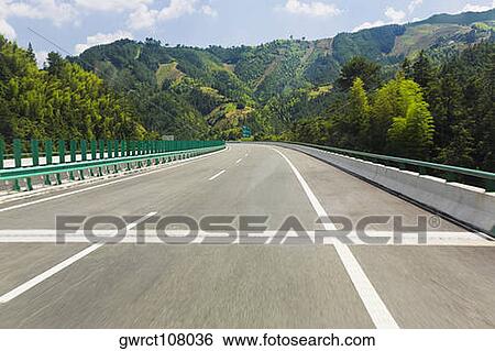 Road leading to a mountain range, Huangshan, Anhui province, China View Large Photo Image Stock Photograph - Road leading to a mountain range, Huangshan, Anhui province, China. Fotosearch