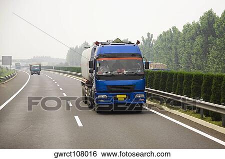 Semi-trucks on a highway, Qufu, Shandong Province, China View Large Photo Image Stock Photograph - Semi-trucks on a highway, Qufu, Shandong Province, China. Fotosearch