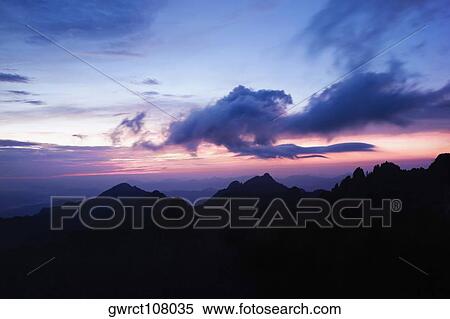 Silhouette of a mountain range at dusk, Huangshan Mountains, Anhui Province, China View Large Photo Image Stock Photography - Silhouette of a mountain range at dusk, Huangshan Mountains, Anhui Province, China. Fotosearch