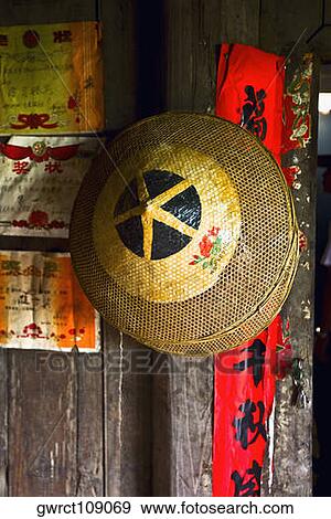 Stock Photo - Close-up of two Asian style conical hats, Jinkeng Terraced Field, Guangxi Province, China. Fotosearch
