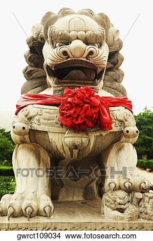 Low angle view of a lion statue at a temple, Zhanshan Temple, Qingdao, Shandong Province, China View Large Photo Image Picture - Low angle view of a lion statue at a temple, Zhanshan Temple, Qingdao, Shandong Province, China. Fotosearch