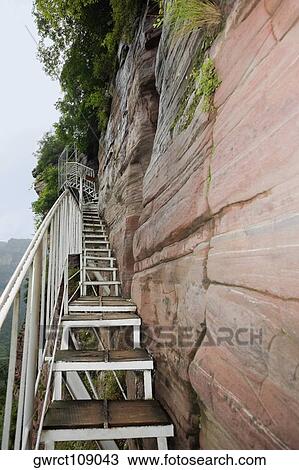 Low angle view of a staircase along a cliff, Taihang Grand Canyon, Linzhou, Henan Province, China View Large Photo Image Stock Image - Low angle view of a staircase along a cliff, Taihang Grand Canyon, Linzhou, Henan Province, China. Fotosearch