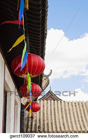 Low angle view of Chinese lanterns hanging on a building, HohHot, Inner Mongolia, China View Large Photo Image Stock Photo - Low angle view of Chinese lanterns hanging on a building, HohHot, Inner Mongolia, China. Fotosearch