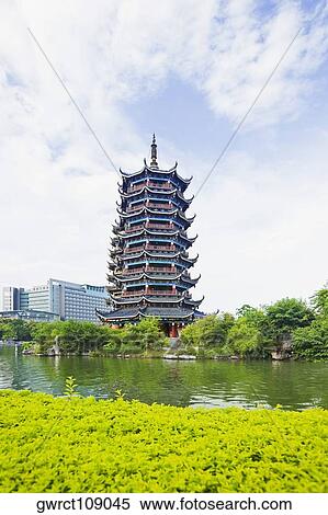 Stock Photography - Low angle view pagoda at the waterfront, Sun and Moon Pagoda, Banyan Lake, Guilin, Guangxi Province, China. Fotosearch