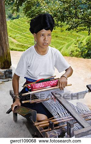 Mature woman weaving a carpet, Jinkeng Terraced Field, Guangxi Province, China View Large Photo Image Stock Photo - Mature woman weaving a carpet, Jinkeng Terraced Field, Guangxi Province, China. Fotosearch