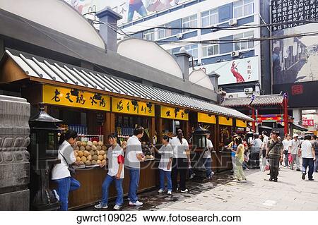 People at a food stall in a market, Wangfujing, Dongcheng District, Beijing, China View Large Photo Image Stock Photography - People at a food stall in a market, Wangfujing, Dongcheng District, Beijing, China. Fotosearch