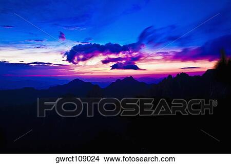 Silhouette of a mountain range at dusk, Huangshan Mountains, Anhui Province, China View Large Photo Image Picture - Silhouette of a mountain range at dusk, Huangshan Mountains, Anhui Province, China. Fotosearch