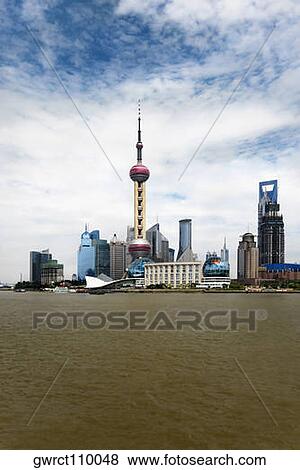 Buildings at the waterfront, Oriental Pearl Tower, Lujiazui, Huangpu River, The Bund, Shanghai, China View Large Photo Image Stock Photo - Buildings at the waterfront, Oriental Pearl Tower, Lujiazui, Huangpu River, The Bund, Shanghai, China. Fotosearch