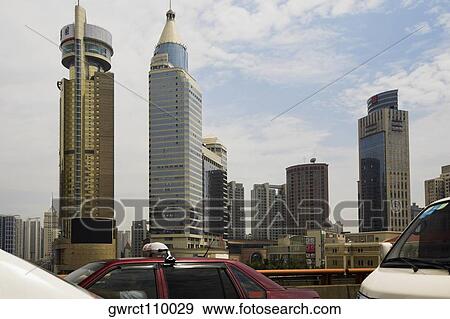 Buildings in a city, Shanghai, China View Large Photo Image Stock Photo - Buildings in a city, Shanghai, China. Fotosearch