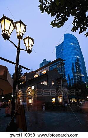 Buildings lit up at dusk, Xintiandi, Shanghai, China View Large Photo Image Stock Photo - Buildings lit up at dusk, Xintiandi, Shanghai, China. Fotosearch