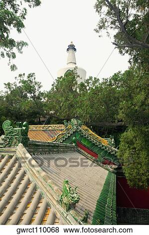 Buildings with a pagoda in the background, Bai Ta, Beihai Park, Beijing, China View Large Photo Image Stock Photo - Buildings with a pagoda in the background, Bai Ta, Beihai Park, Beijing, China. Fotosearch
