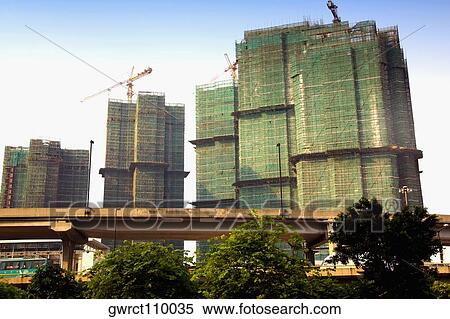 Low angle view of skyscrapers in a city, Shamian Island, Guangzhou, Guangdong Province, China View Large Photo Image Stock Photography - Low angle view of skyscrapers in a city, Shamian Island, Guangzhou, Guangdong Province, China. Fotosearch