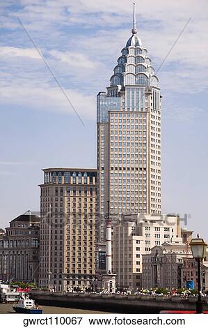 Skyscraper in a city, The Bund, Huangpu River, Shanghai, China View Large Photo Image Stock Photo - Skyscraper in a city, The Bund, Huangpu River, Shanghai, China. Fotosearch