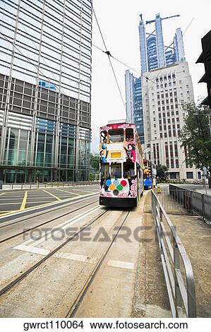 Trams moving on the track, Des Voeux Road, Hong Kong Island, China View Large Photo Image Picture - Trams moving on the track, Des Voeux Road, Hong Kong Island, China. Fotosearch