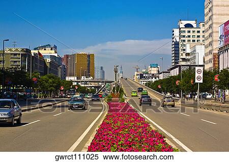 Stock Photography - Cars moving on the road, HohHot, Inner Mongolia, China. Fotosearch