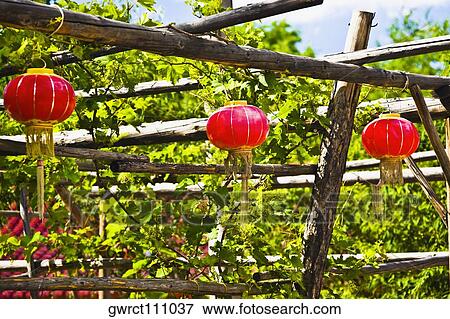 Chinese lanterns hanging on a wooden post, Hohhot, Inner Mongolia, China View Large Photo Image Stock Photo - Chinese lanterns hanging on a wooden post, Hohhot, Inner Mongolia, China. Fotosearch