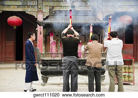 Four men praying in front of a temple, Dai Temple, Mt Tai, Tai'an, Shandong Province, China View Large Photo Image Stock Image - Four men praying in front of a temple, Dai Temple, Mt Tai, Tai'an, Shandong Province, China. Fotosearch