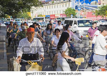 Group of people riding bicycles, HohHot, Inner Mongolia, China View Large Photo Image Stock Image - Group of people riding bicycles, HohHot, Inner Mongolia, China. Fotosearch