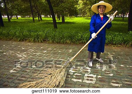 Portrait of a female sweeper sweeping, Temple of Heaven, Beijing, China View Large Photo Image Stock Photo - Portrait of a female sweeper sweeping, Temple of Heaven, Beijing, China. Fotosearch