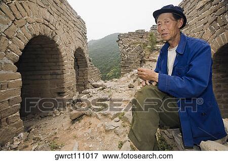 Portrait of a senior man sitting on a wall, Great Wall Of China, Beijing, China View Large Photo Image Stock Photo - Portrait of a senior man sitting on a wall, Great Wall Of China, Beijing, China. Fotosearch