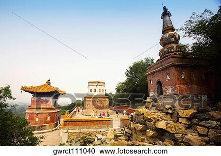 Trees around buildings, Tower of Dawn Light, Summer Palace, Beijing, China View Large Photo Image Stock Image - Trees around buildings, Tower of Dawn Light, Summer Palace, Beijing, China. Fotosearch
