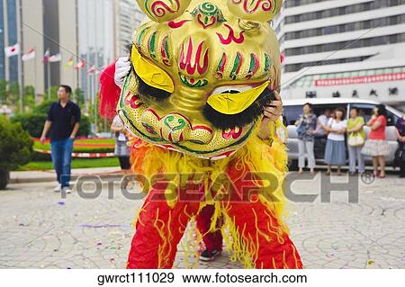 Two people in Chinese dragon costume, Qingdao, Shandong Province, China View Large Photo Image Stock Photo - Two people in Chinese dragon costume, Qingdao, Shandong Province, China. Fotosearch