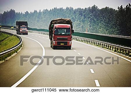 Two semi-trucks on a highway, Qufu, Shandong Province, China View Large Photo Image Stock Photography - Two semi-trucks on a highway, Qufu, Shandong Province, China. Fotosearch