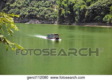 Boat in a river, XingPing, Yangshuo, Guangxi Province, China View Large Photo Image Stock Image - Boat in a river, XingPing, Yangshuo, Guangxi Province, China. Fotosearch