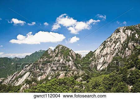 Clouds over a mountain range, Huangshan, Anhui province, China View Large Photo Image Picture - Clouds over a mountain range, Huangshan, Anhui province, China. Fotosearch