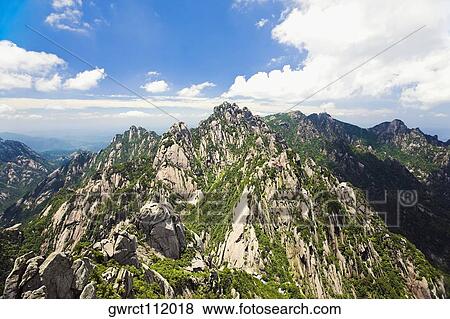 Clouds over a mountain range, Huangshan, Anhui province, China View Large Photo Image Stock Photo - Clouds over a mountain range, Huangshan, Anhui province, China. Fotosearch