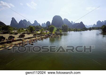 Hills along a river, Guilin Hills, XingPing, Yangshuo, Guangxi Province, China View Large Photo Image Picture - Hills along a river, Guilin Hills, XingPing, Yangshuo, Guangxi Province, China. Fotosearch