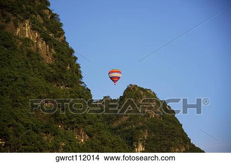Low angle view of a hot air balloon, Yangshuo, Guangxi Province, China View Large Photo Image Picture - Low angle view of a hot air balloon, Yangshuo, Guangxi Province, China. Fotosearch