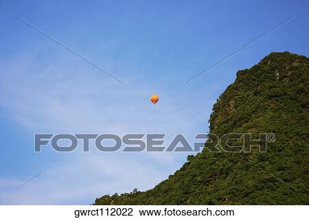 Low angle view of a hot air balloon, Yangshuo, Guangxi Province, China View Large Photo Image Stock Image - Low angle view of a hot air balloon, Yangshuo, Guangxi Province, China. Fotosearch