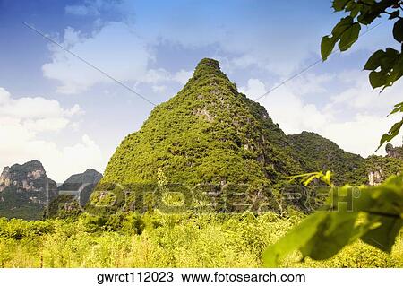 Low angle view of hill ranges, Yangshuo, Guangxi Province, China View Large Photo Image Stock Image - Low angle view of hill ranges, Yangshuo, Guangxi Province, China. Fotosearch