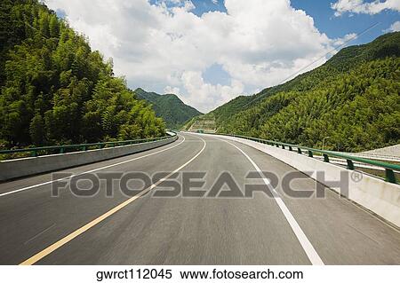 Stock Photography - Road passing through mountains, Huangshan Mountains, Anhui Province, China. Fotosearch