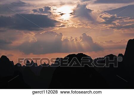 Silhouette of hills at dusk, XingPing, Yangshuo, Guangxi Province, China View Large Photo Image Stock Photo - Silhouette of hills at dusk, XingPing, Yangshuo, Guangxi Province, China. Fotosearch