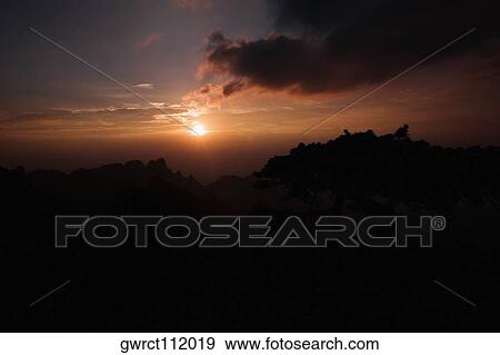 Stock Photo - Sunset over a mountain, Huangshan Mountains, Anhui Province, China. Fotosearch