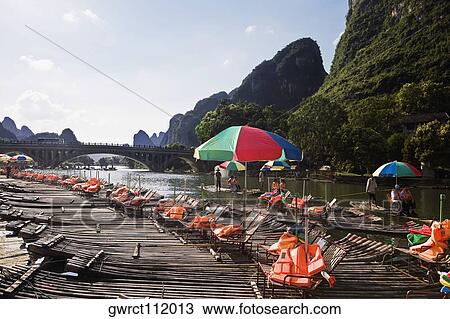 Tourist resort in a river, Guilin Hills, XingPing, Yangshuo, Guangxi Province, China View Large Photo Image Stock Image - Tourist resort in a river, Guilin Hills, XingPing, Yangshuo, Guangxi Province, China. Fotosearch