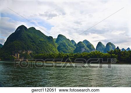 Trees at the riverside, Li River, XingPing, Yangshuo, Guangxi Province, China View Large Photo Image Stock Image - Trees at the riverside, Li River, XingPing, Yangshuo, Guangxi Province, China. Fotosearch