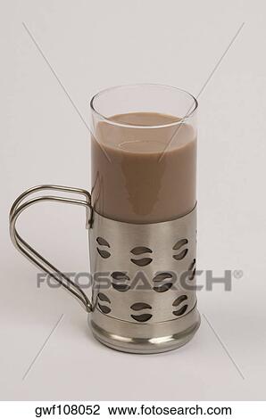 Stock Image - Close-up of a mug of chocolate milkshake. Fotosearch