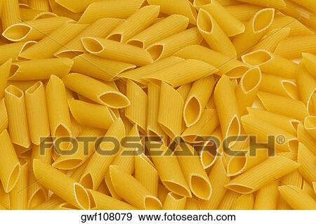Close-up of raw macaroni View Large Photo Image Stock Photo - Close-up of raw macaroni. Fotosearch