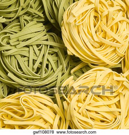 Stock Photo - Close-up of raw tagliatelle. Fotosearch