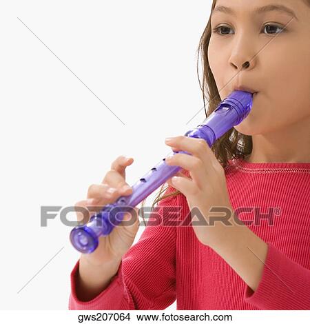 Close-up of a schoolgirl playing a flute in a classroom View Large Photo Image Picture - Close-up of a schoolgirl playing a flute in a classroom. Fotosearch