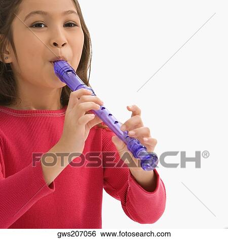 Close-up of a schoolgirl playing a flute in a classroom View Large Photo Image Stock Photograph - Close-up of a schoolgirl playing a flute in a classroom. Fotosearch
