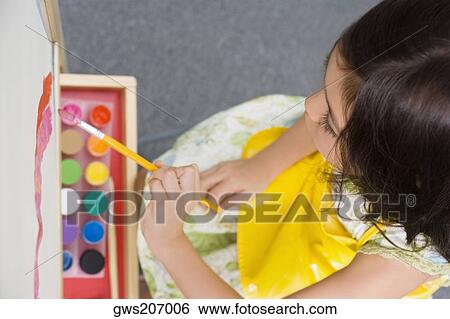 High angle view of a schoolgirl painting in an art class View Large Photo Image Stock Photograph - High angle view of a schoolgirl painting in an art class. Fotosearch
