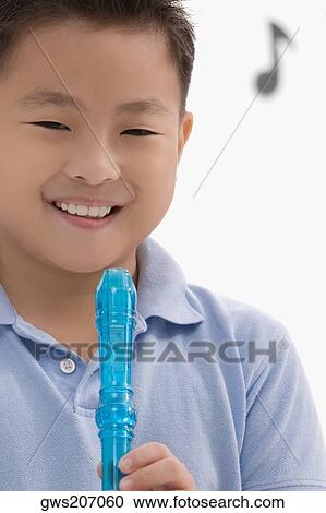 Portrait of a schoolboy holding a flute View Large Photo Image Stock Image - Portrait of a schoolboy holding a flute. Fotosearch