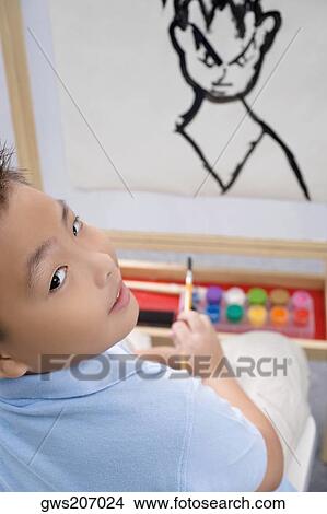 Portrait of a schoolboy painting in an art class View Large Photo Image Picture - Portrait of a schoolboy painting in an art class. Fotosearch
