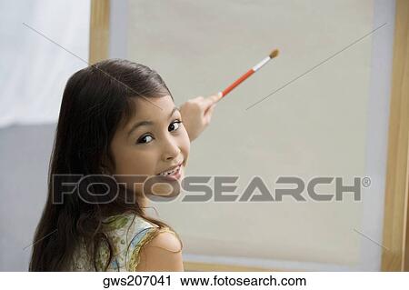 Portrait of a schoolgirl painting in an art class View Large Photo Image Stock Image - Portrait of a schoolgirl painting in an art class. Fotosearch
